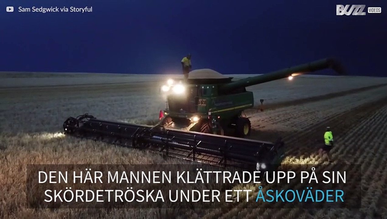 Man dansar ovanpå en skördetröska under ett åskoväder