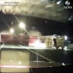 captures the moment a semi truck flipped over on bridge in Portland OregonNo injuries were report