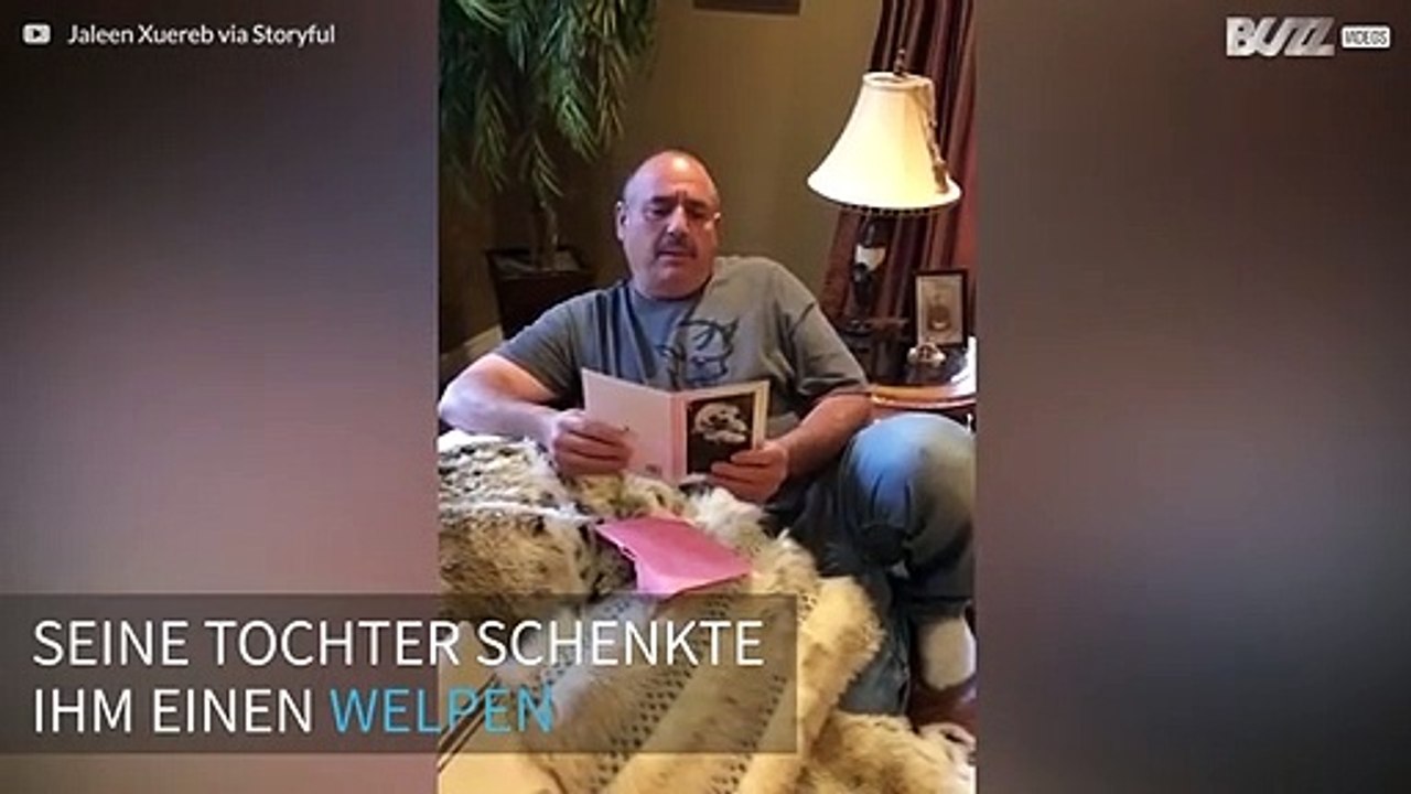 Trauernder Mann wird von einem neuen Familienmitglied überrascht