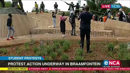 Students attempt to pull down a statue in Joburg