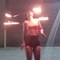 Woman Does Amazing Tricks With Hula Hoop on Fire