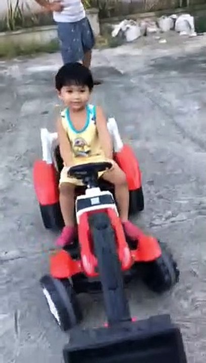 Riding with his toy