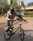 Guy Moves Bicycle in Circular Motion While Performing Wheelie on it