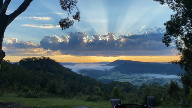 Stunning View as Sunrise Peeks Through the Clouds