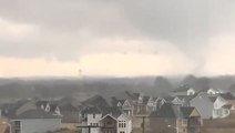 Tornado sirens blare as Kansans look to the sky