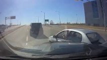 Car Crashes Into Vehicle As It Turns Into the Road After Stopping For Red Light