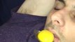 Person Pranks Guy Asleep on Bed By Putting Raw Egg in His Mouth