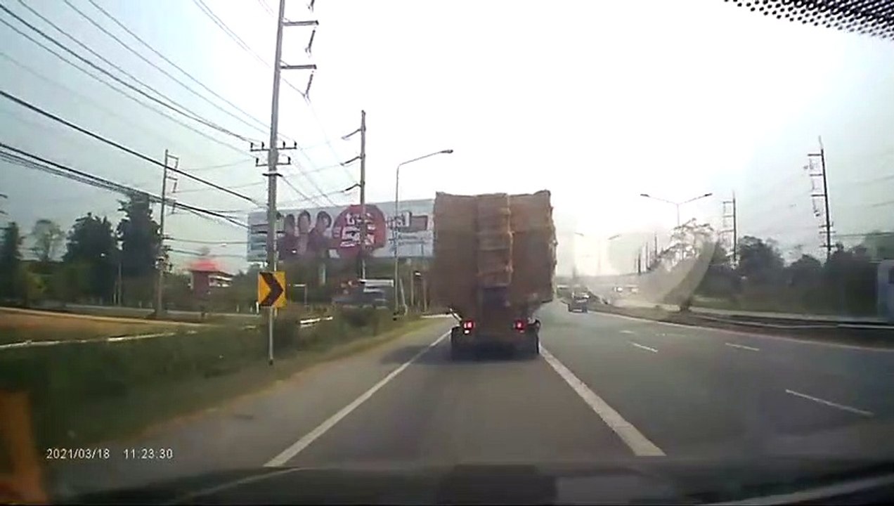 Truck Hauling Massive Straw Load Takes Turn too Fast