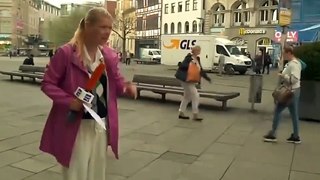 Pedestrian Takes out Cyclist with his Umbrella during Live TV Broadcast