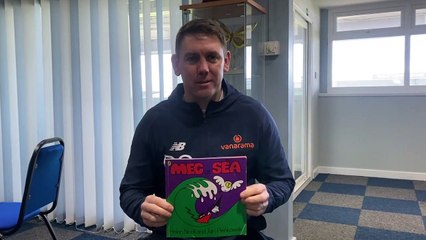 Hartlepool United manager Dave Challinor reads a children's story to support the ongoing £50,000 appeal to help buy a caravan for the town's carers.
