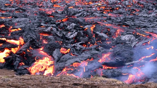 Visitors gather as Icelandic volcano subsides following eruption