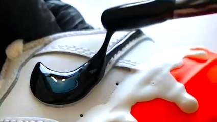 Artist freehands 3D custom drip-effect sneakers