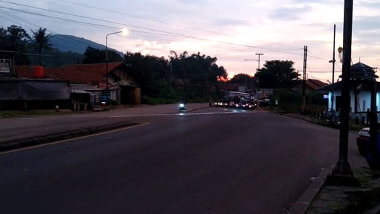 Motorcyclist Has Close Call with Oncoming Train