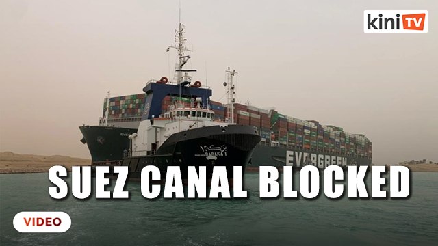 Tugs work to free giant container ship stranded in Suez Canal