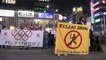 "Stop the Olympics" - Anti-Olympics protesters oppose the games as relay starts