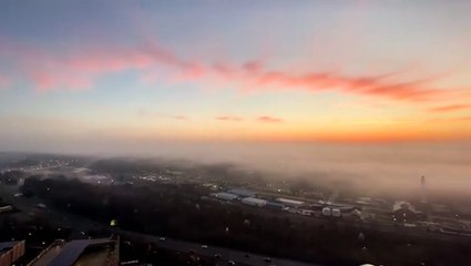 Colorful sunrise shines over foggy Richmond
