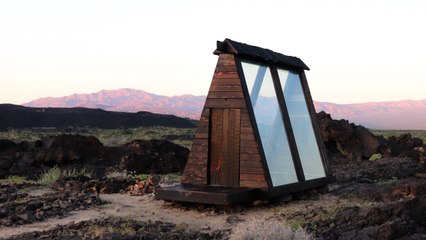 This Tiny California Cabin Is Inside an Ancient Volcanic Crater — and Its Glass Walls Let