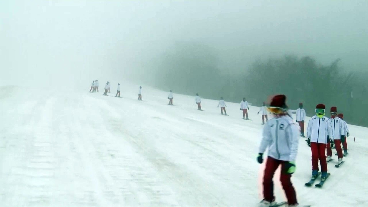 Olympic flame carried on skis on day two of Tokyo 2020 torch relay