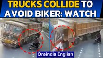 Hyderabad: Trucks collide  after biker appears on road | Oneindia News