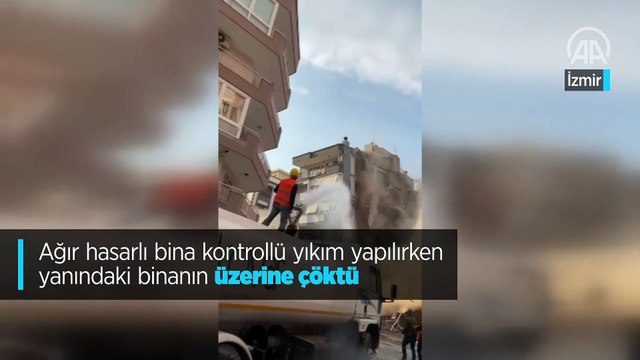 Ağır hasarlı bina kontrollü yıkım yapılırken yanındaki binanın üzerine çöktü