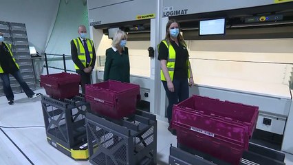 Robot delivers gift to Camilla during pharmacy visit