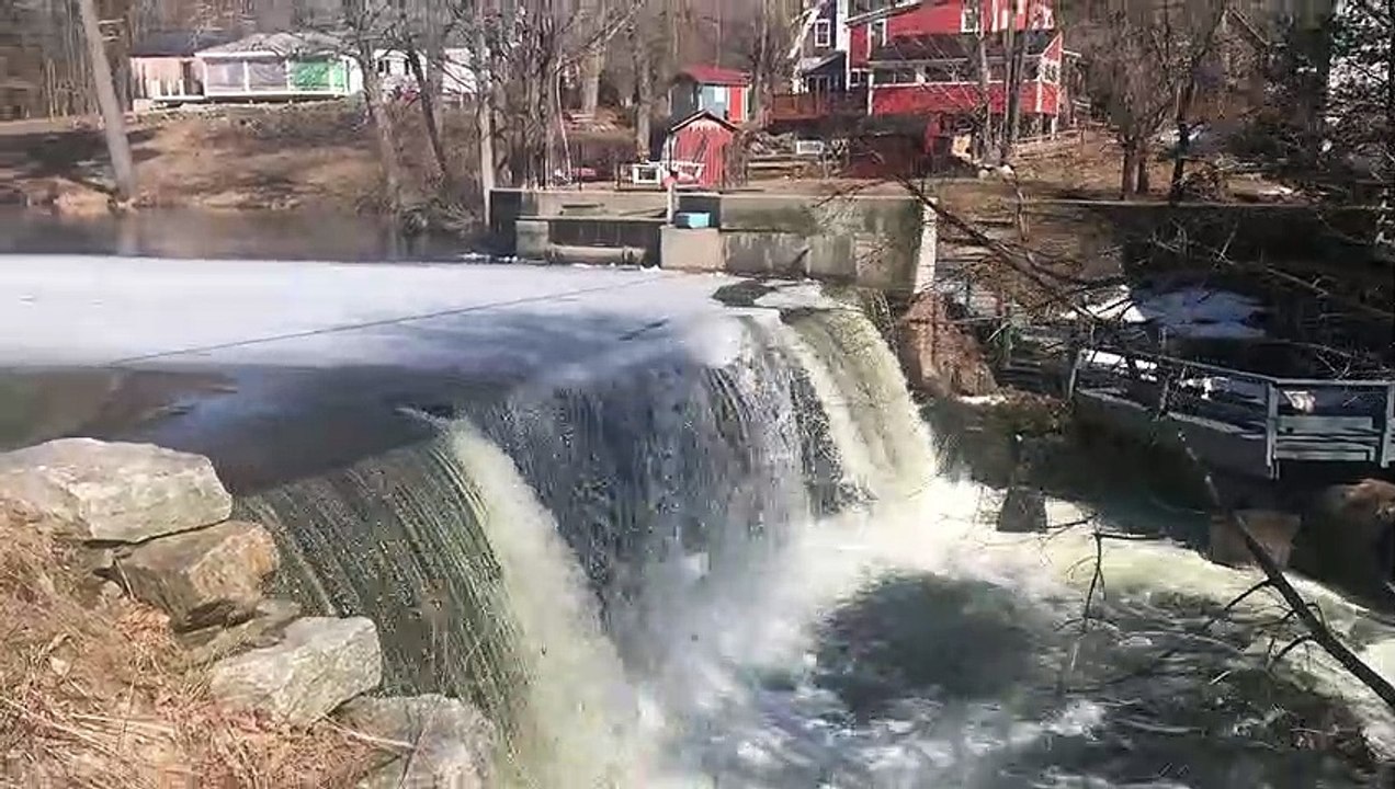 Ice Sheet Crumbles Off Waterfall