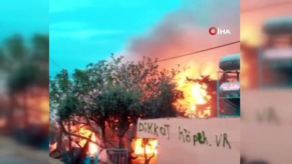 Alev topuna dönen evde baygınlık geçiren kadını, komşuları son anda kurtardı