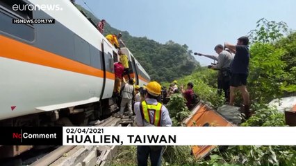 Survivors led away from Taiwan train crash as dead toll rises