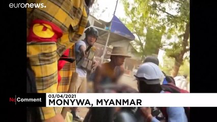 Protester bleeding from the head evacuated and Motorbike protest against coup