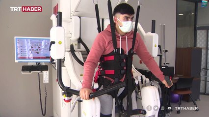 Tải video: Yerli yürüyüş rehabilitasyon robotu felçli hastalara umut oldu