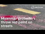 Myanmar protesters throw red paint on streets