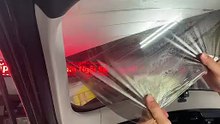 Bóc film kính hậu Kia Carent