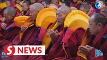 13 Tibetan monks receive Buddhism's highest degree
