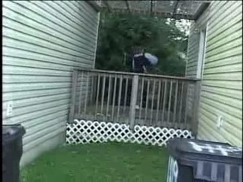 Louisville Cop Trips Over Fence During Drug Raid