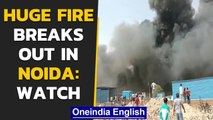 Noida: Several huts catch fire as huge fire breaks out near sector 63, reason unknown| Oneindia News