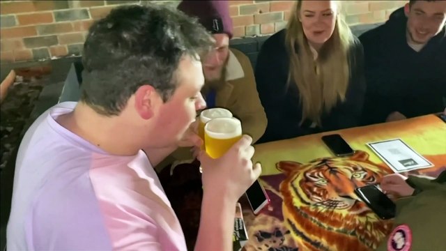English pubgoers brave cold temperatures to enjoy first outdoor pints as lockdown eases