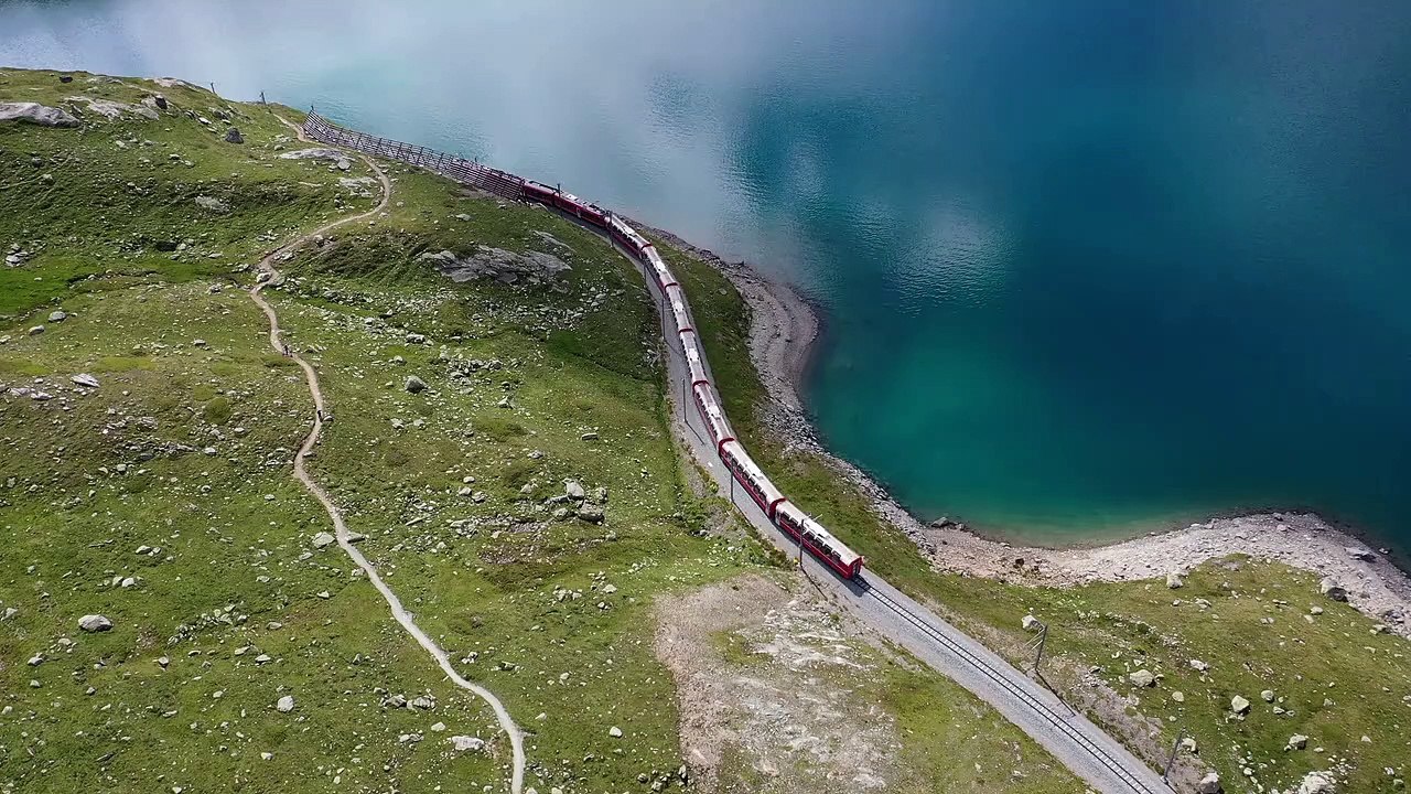 Amazing Aerial View Of A Train Passing Through Mountain & Sea 8k