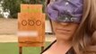 Woman Shows Amazing Trick Shots While Throwing Sharp Objects At Wooden Board