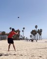 Guy Throws and Catches Ball While Balancing Himself Over Slackline
