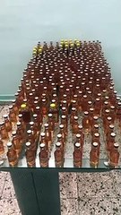 Policía Nacional apresa a dos hombres intentaban vender 335 botellas de ron de forma ilegal