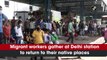 Migrant workers leave for their native places after Delhi imposed a Covid-19 lockdown