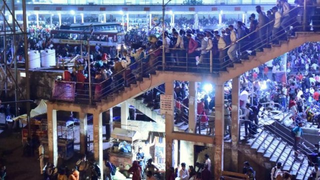 Migrant workers head home as lockdown imposed in Delhi