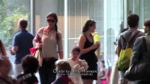 Katie Holmes carries Suri Cruise inside the MOMA in NYC