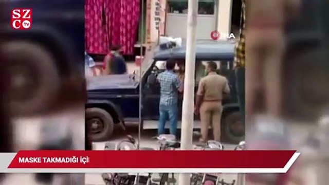 Maske takmadığı için ceza kesen polise tokat attı