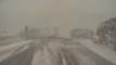 Dashcam Captures Two Trucks Colliding on Highway Amidst Heavy Snowfall