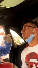 Squirming Friend Struggles with Swab