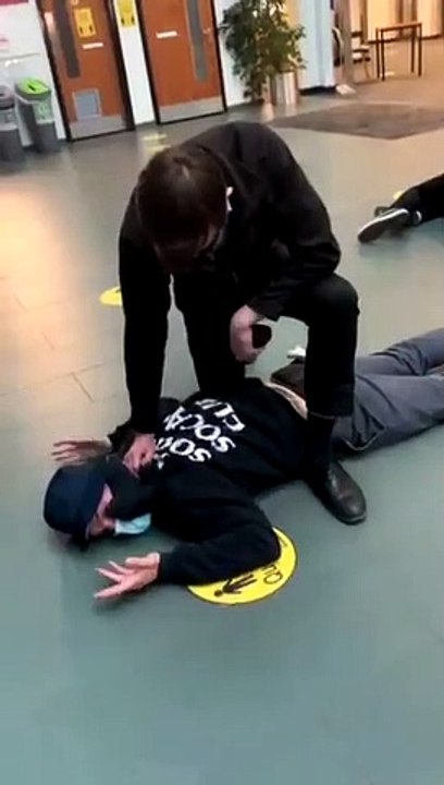 Student pinned down during rent strike protest