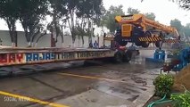 Escorts Heavy Machinery loading on to a Truck | ODC Transportation