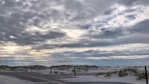 Clouds Move Over the Sand Dunes - Timelapse