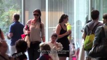 Katie Holmes carries Suri Cruise inside the MOMA in NYC